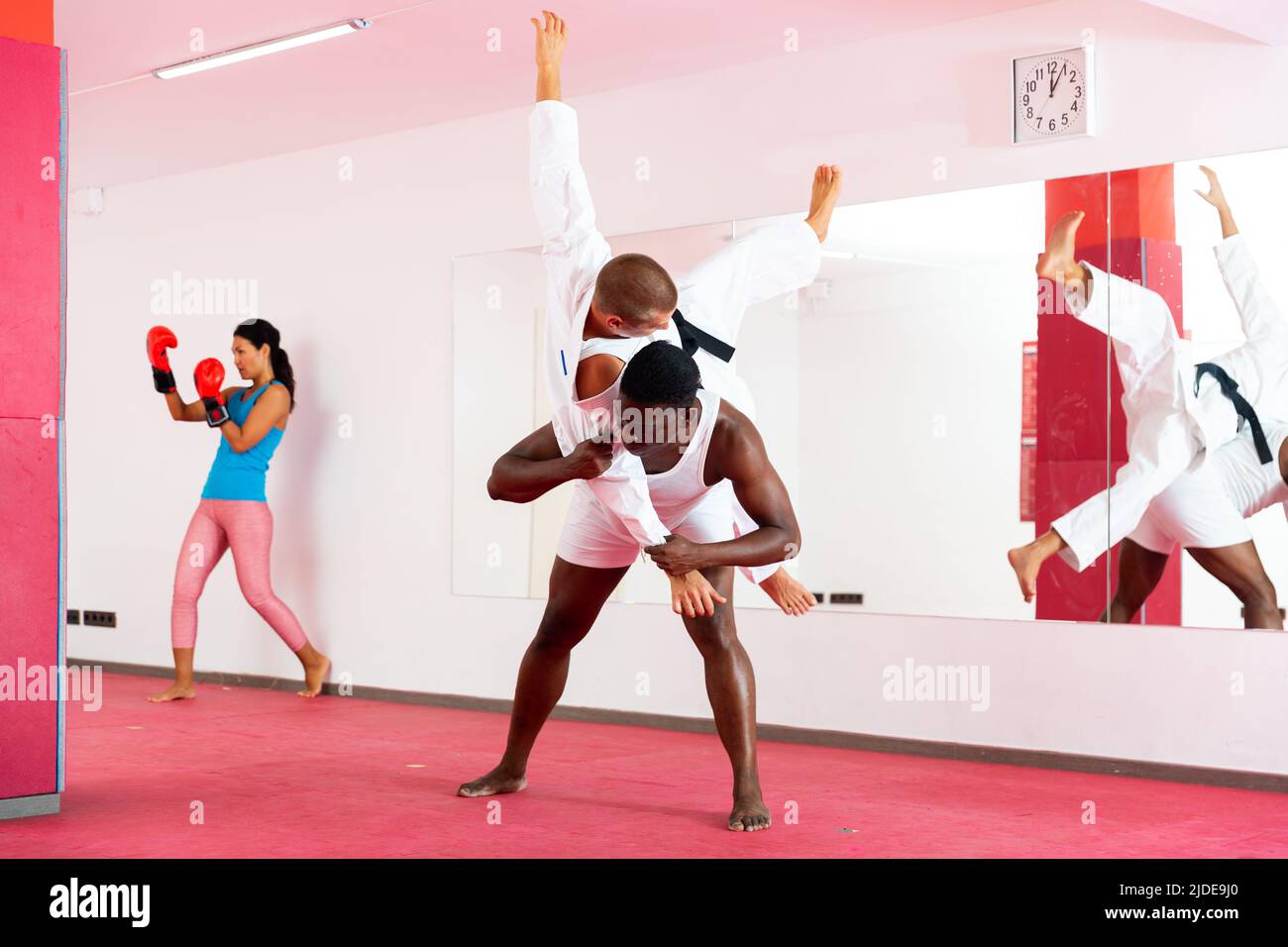 People training martial arts moves in gym Stock Photo Alamy