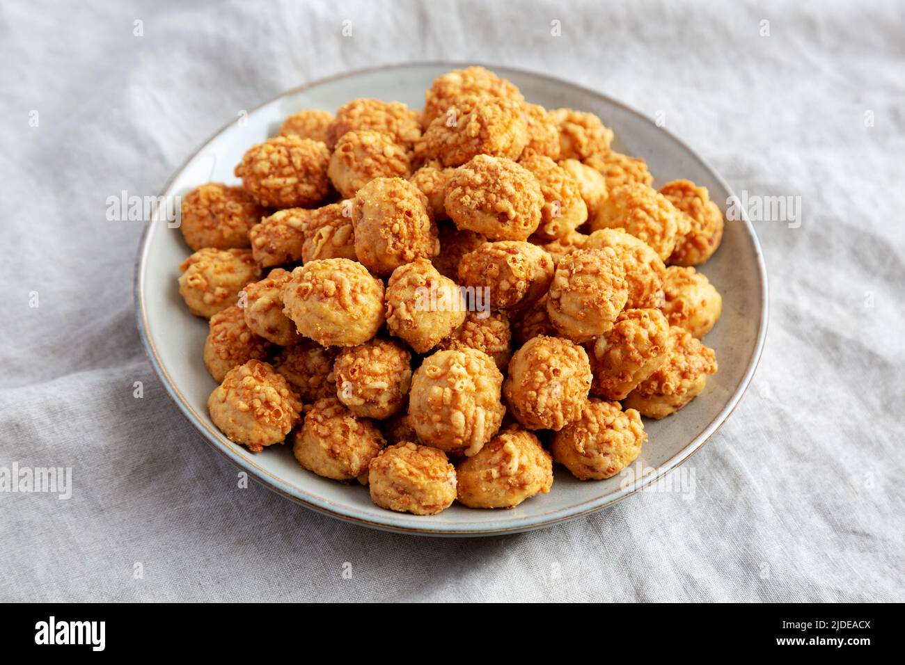Homemade Crumbly Biscuits with Parmigiano Reggiano on a Plate, side