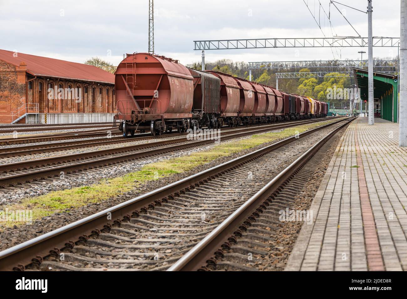Cargo train platform with the container. Railroad depot Stock Photo