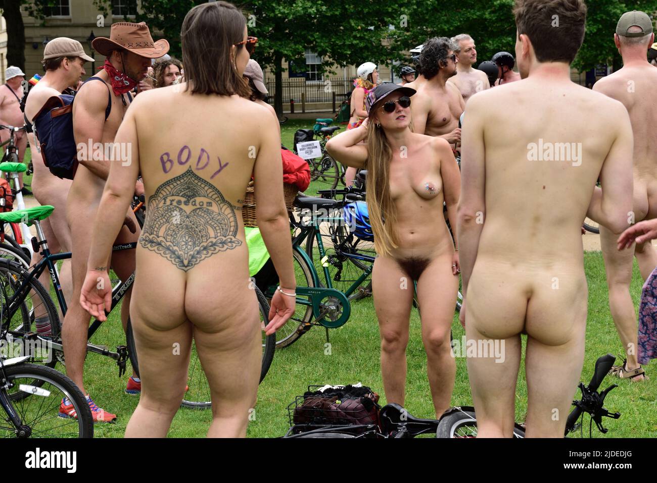 Participants in World Naked Bike Ride in Bristol 2022 at rest stop in Queens Square, Bristol, UK Stock Photo
