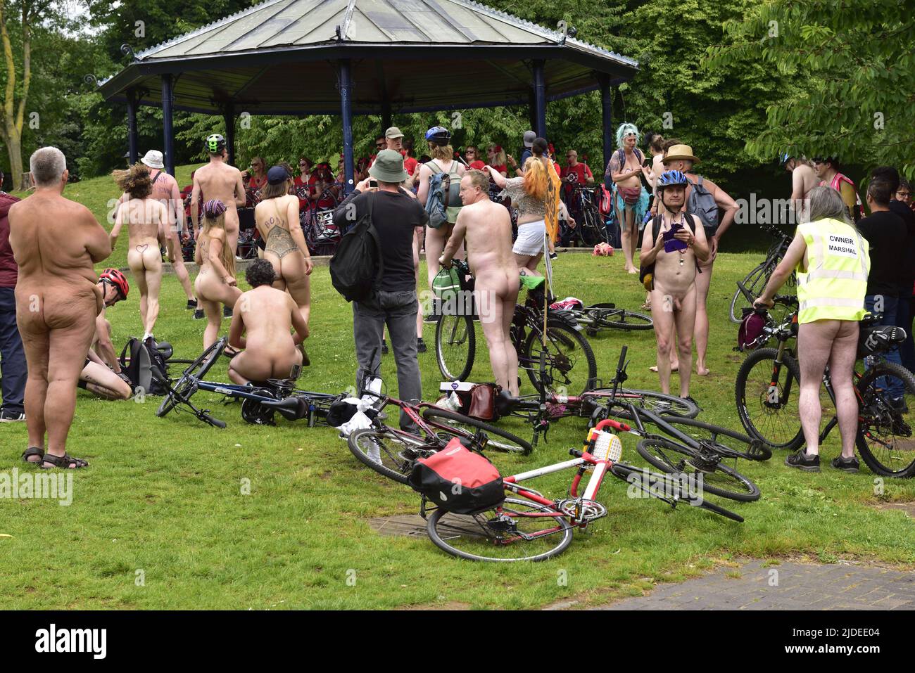 Participants in World Naked Bike Ride in Bristol 2022 during rest stop at Castle Park, Bristol, UK, listing and dancing to the Bristol Batalia drummin Stock Photo