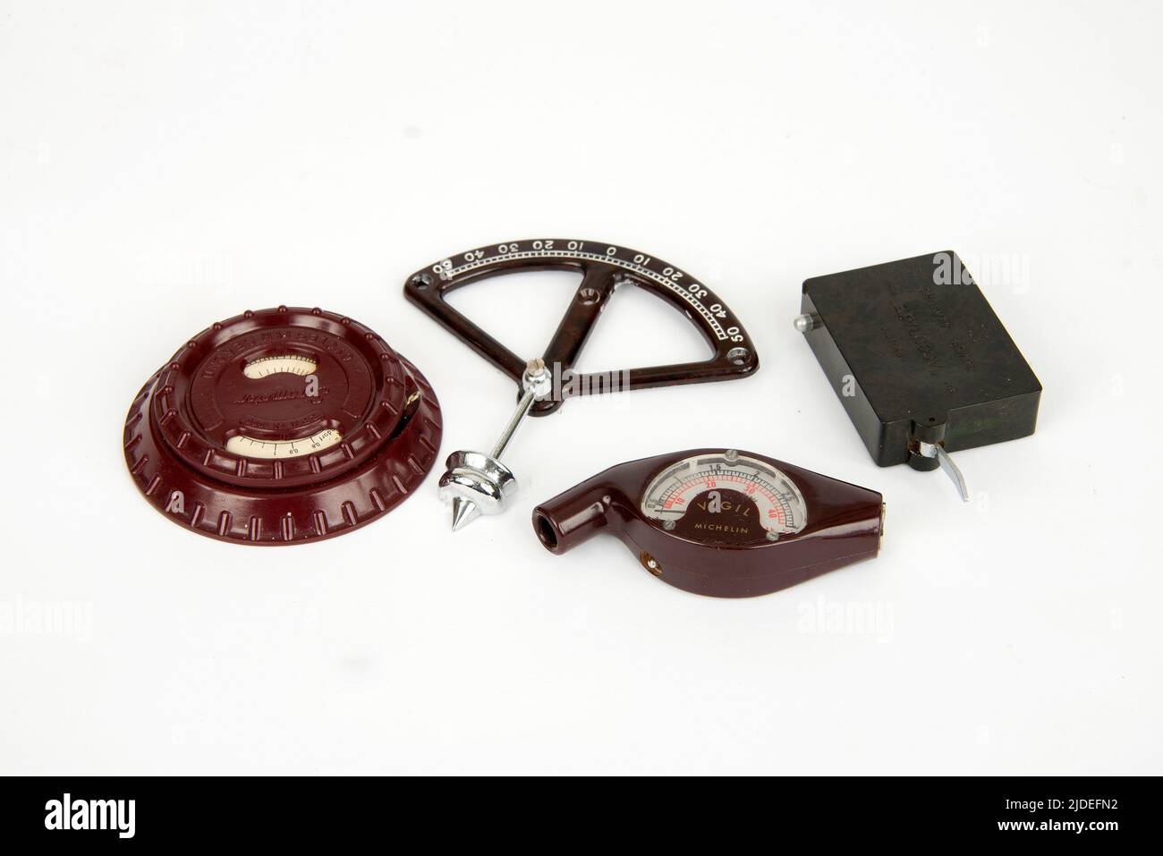 Bakelite items, a radio component, inclinometer, tyre measuring guage ...