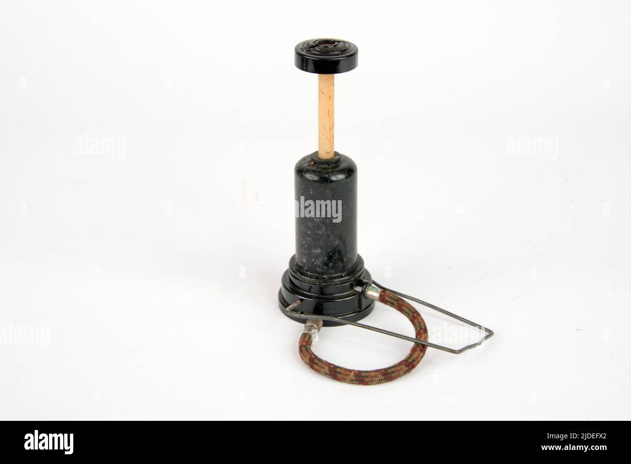 A selection of bakelite and plastic items.  Compact cycle pump, foot or hand operated. Stock Photo
