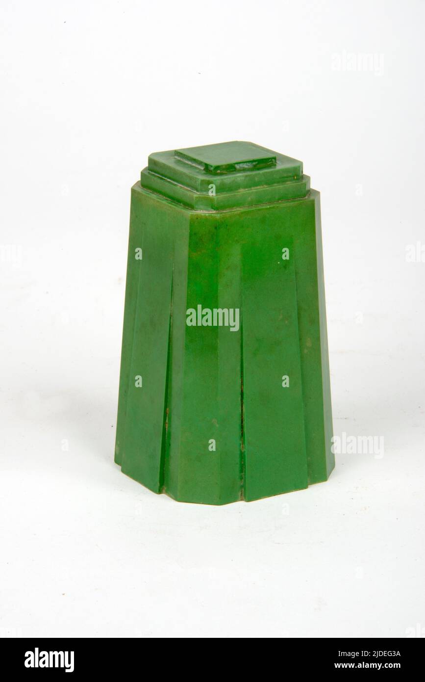A selection of bakelite and plastic items.  A green Art Deco pot in urea formaldehyde. Stock Photo