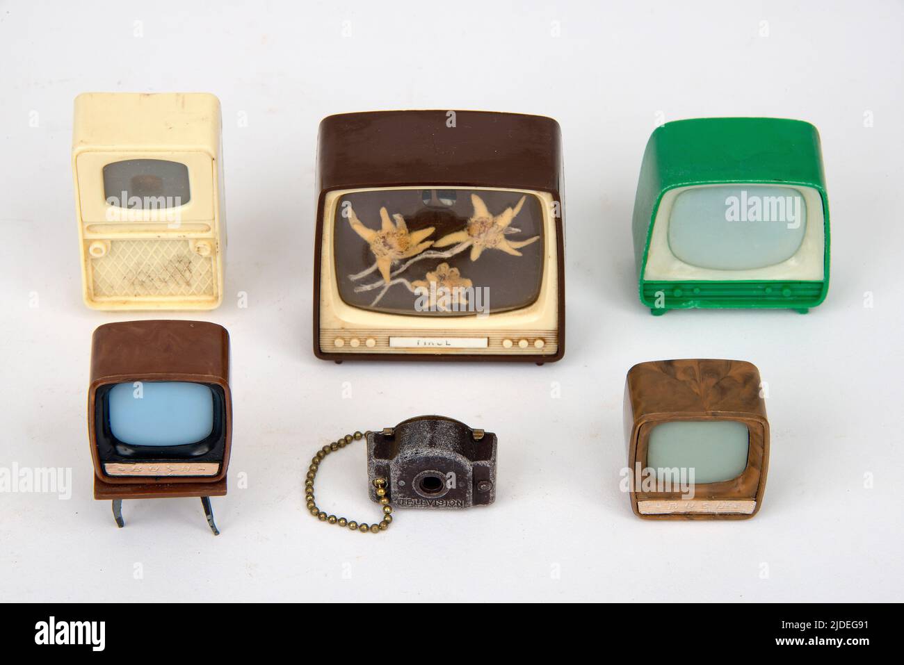 A selection of bakelite and plastic items.  Bakelit toy miniature televisions. Stock Photo