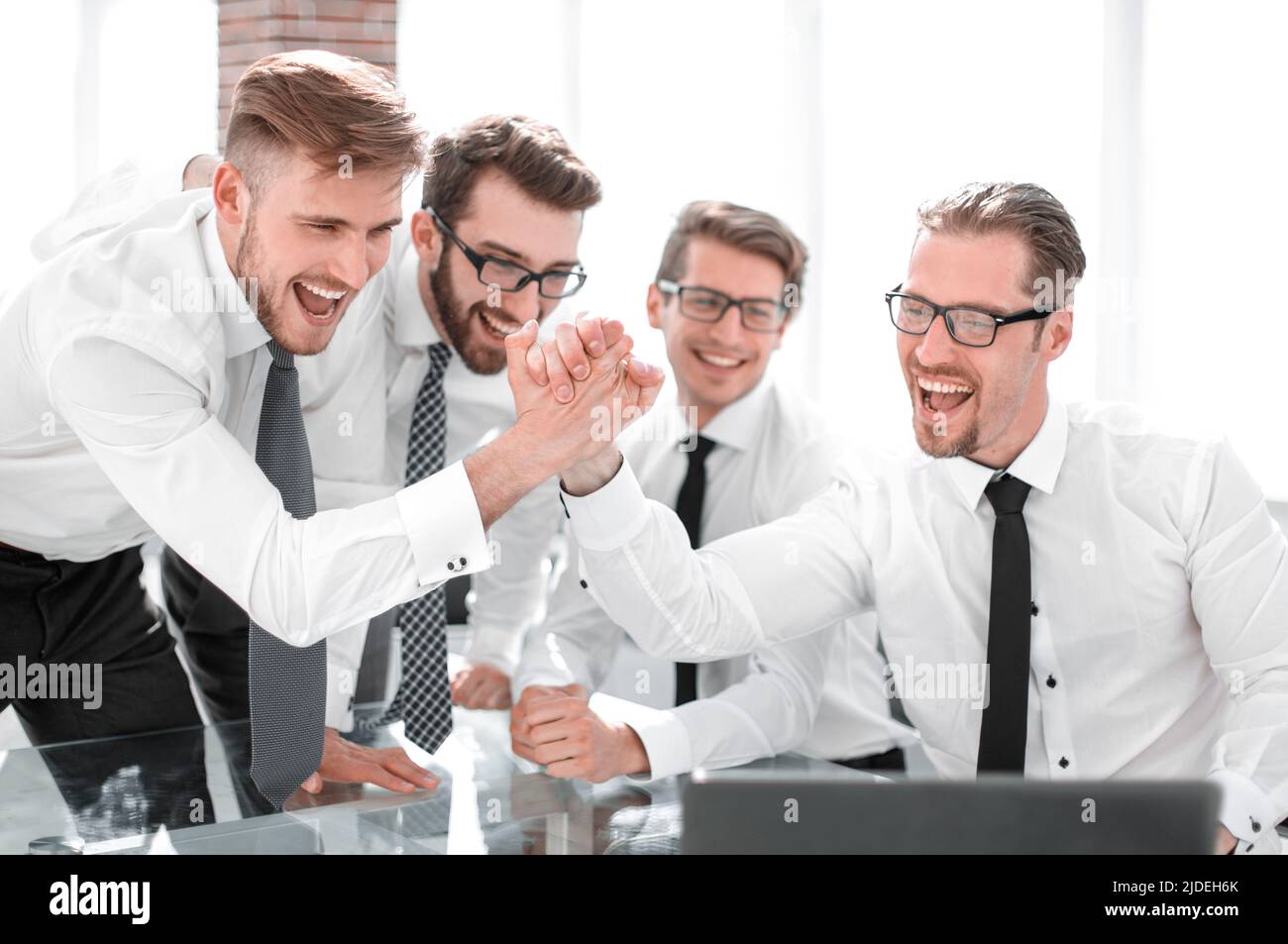 employees-giving-each-other-a-high-five-stock-photo-alamy