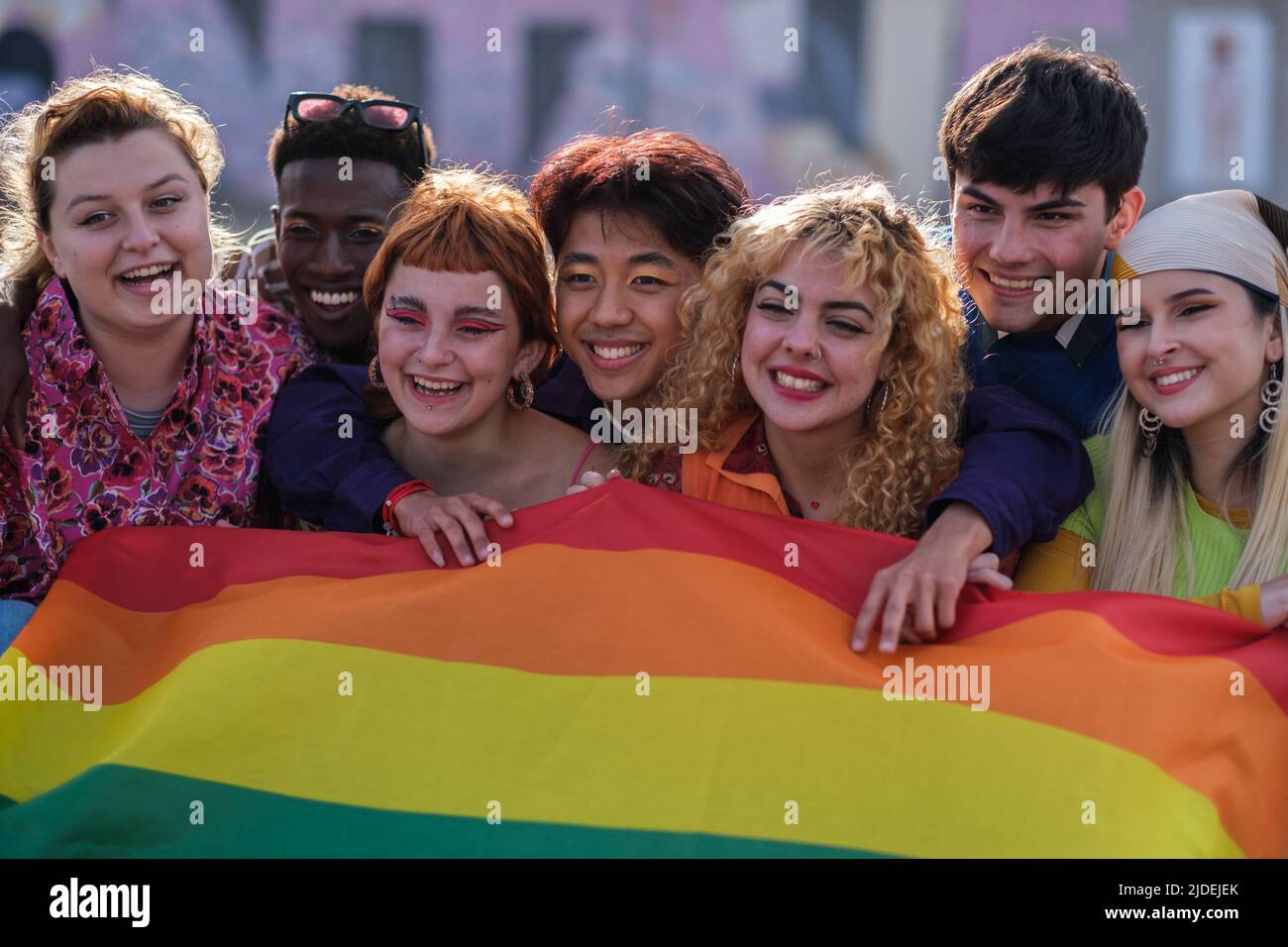 Portrait of teenagers with the lgtbi flag fighting for their rights