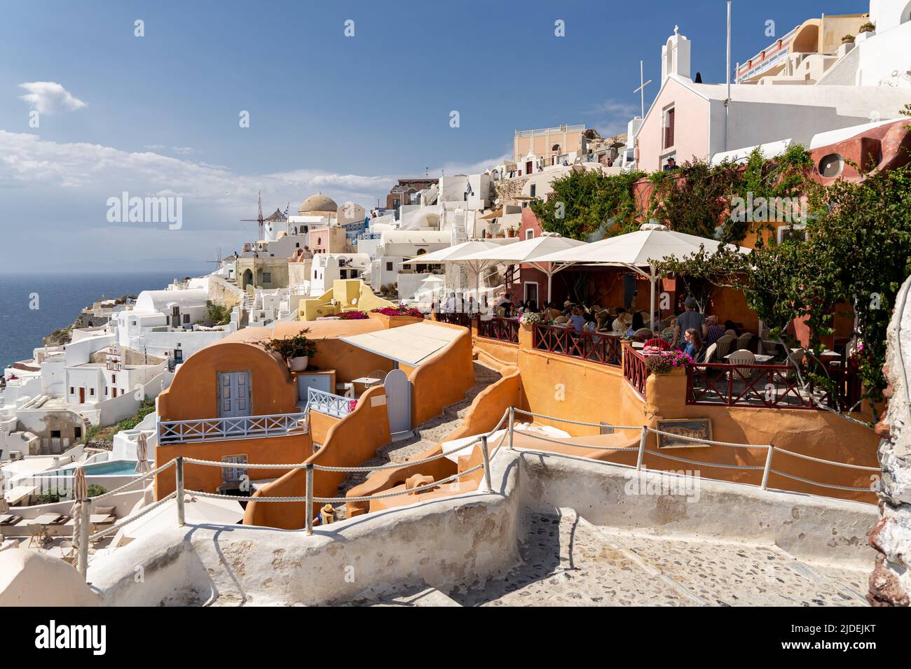 A view of Oia's Wes Anderson house with the town in the background Stock Photo