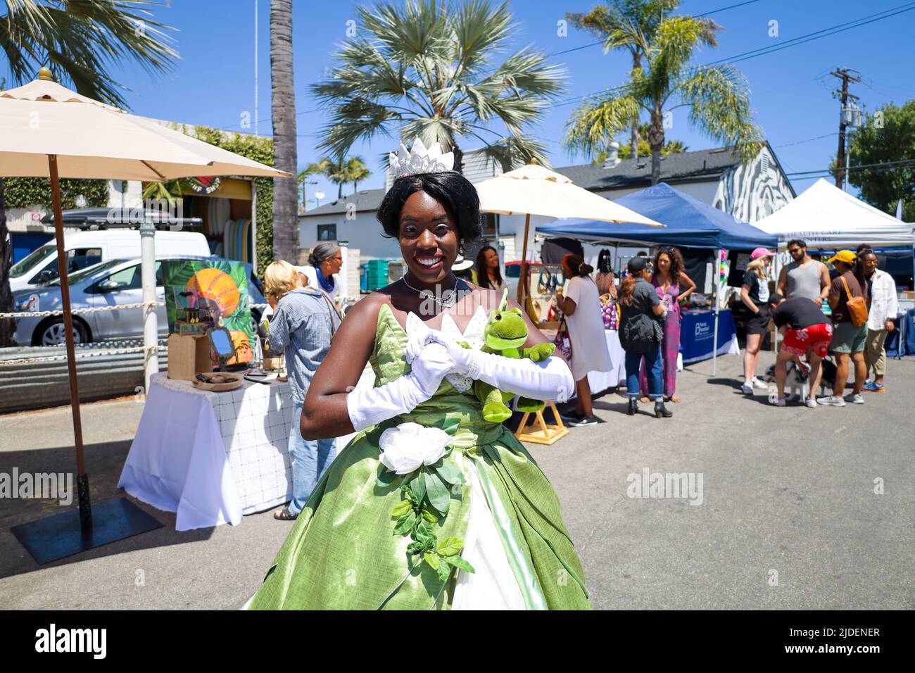 Santa Barbara, California, USA. 19th June, 2022. Juneteenth Santa Barbara celebration, at the 200 E. Grey Ave. block, on June 19, 2022. Pictured here as Princess Tiana from Princess and the Frog is Bria Bennett, aka The Chocolate Princess. Now an official national holiday in the USA, hundreds were in attendance celebrating the anniversary of the end of slavery, and promoting African American led businesses and non-profit serving the black communities. The theme this year is Caring For the People. (Credit Image: © Amy Katz/ZUMA Press Wire) Stock Photo