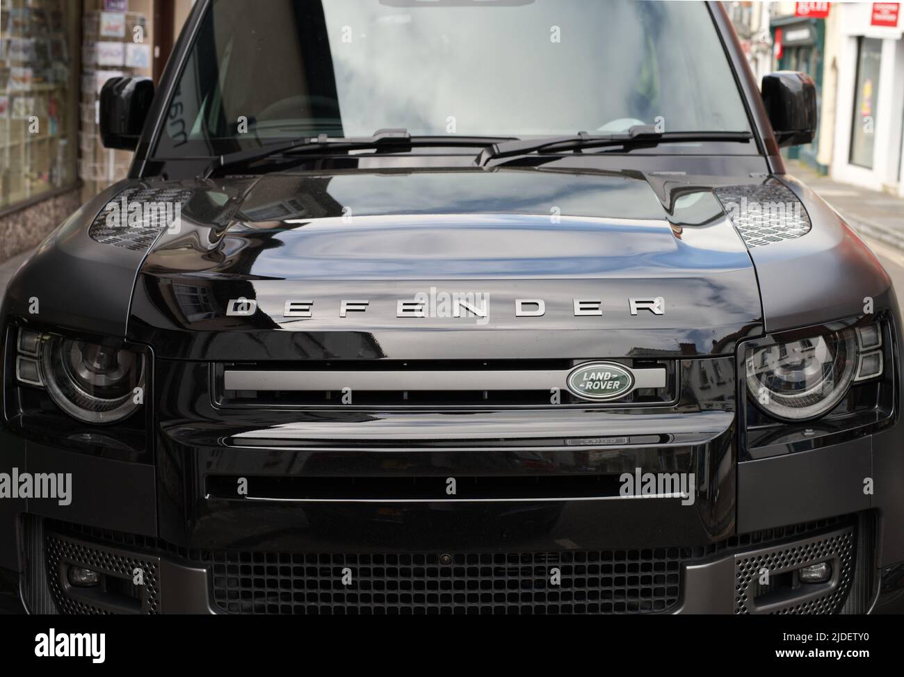 Front view of black Land Rover Defender parked in Wells, Somerset, UK Stock Photo