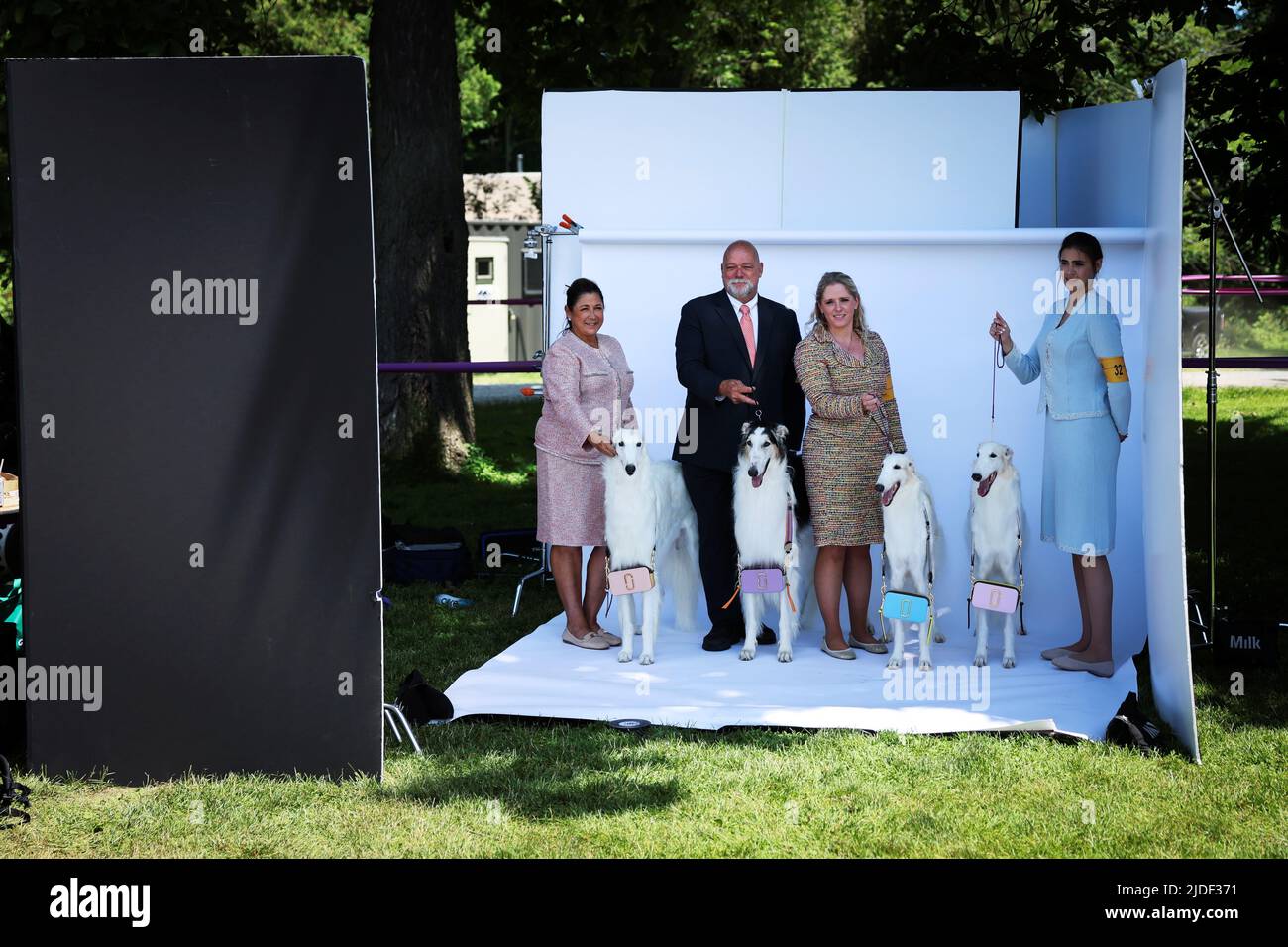 Handlers stand and pose with Borzoi dogs on a photo set at the 146th Westminster Kennel Club Dog Show at the Lyndhurst Estate in Tarrytown, New York, U.S., June 20, 2022. REUTERS/Mike Segar Stock Photo