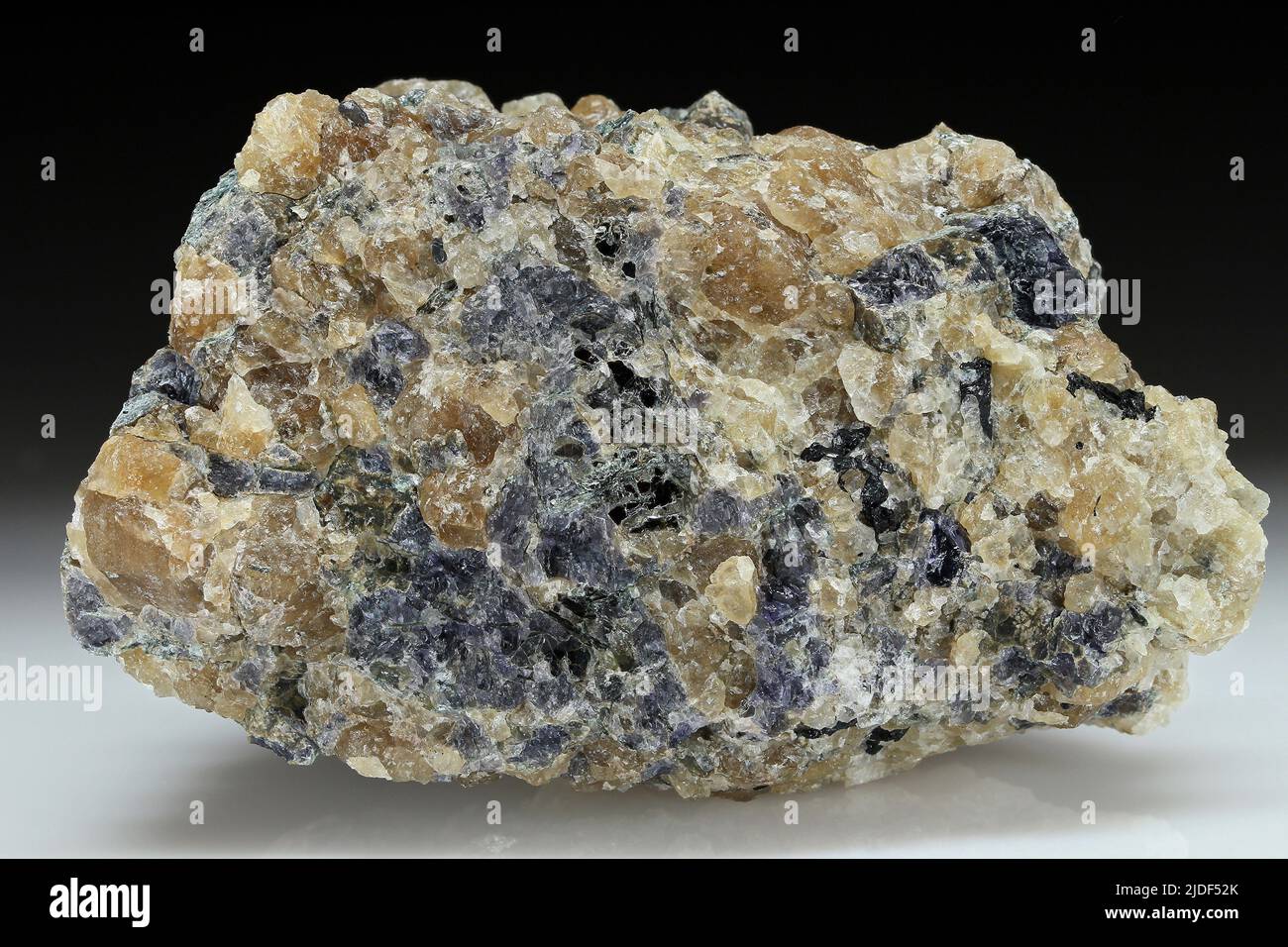 Cordierite. minerals. North America; USA; Connecticut; Middlesex; Chester; 400 m past Cockaponset Forest Rd. bifurcation, along N Cedar Rd.; then 200 m east Stock Photo