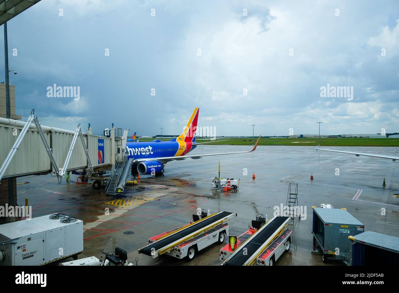 Stock images of South West Airlines at airport gate during weather delays. Airplane at gate in service. Stock Photo