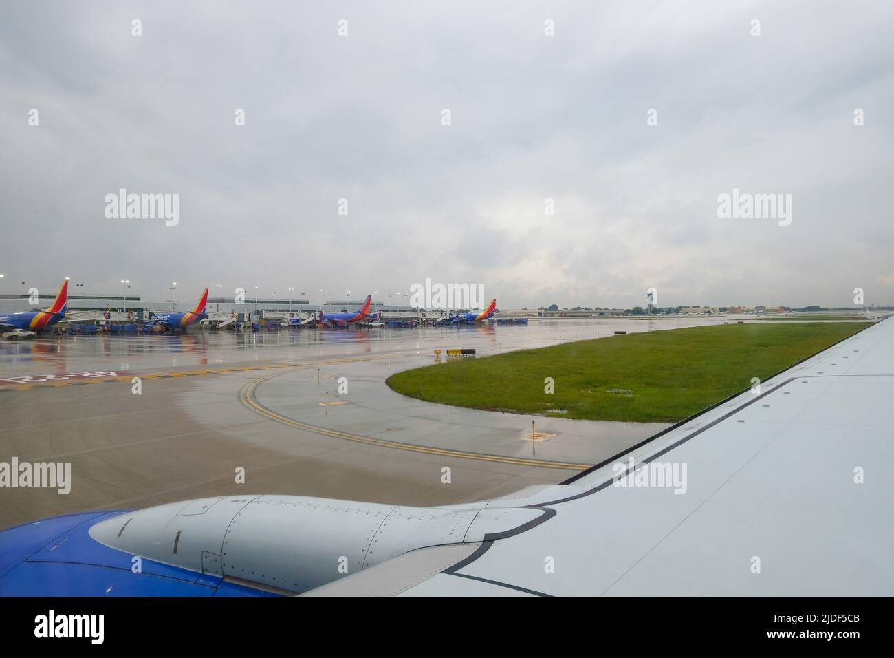 Stock images of South West Airlines airplanes lined up at gate taken from plane window Stock Photo