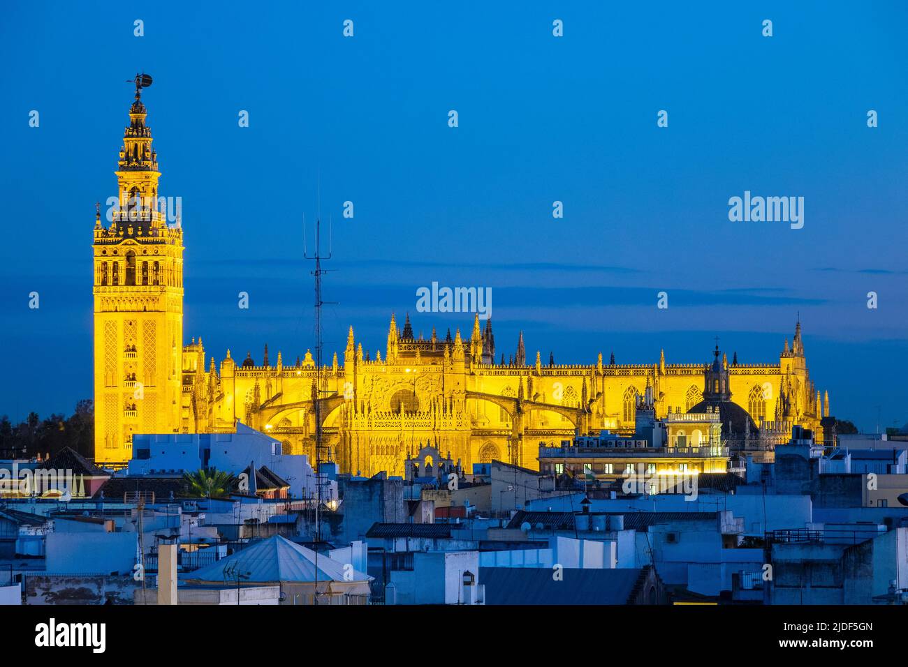 The Cathedral of Saint Mary of the See (Catedral de Santa María de la Sede), Lights Up At Night Seville Cathedral, Seville City Skyline Seville Spain Stock Photo
