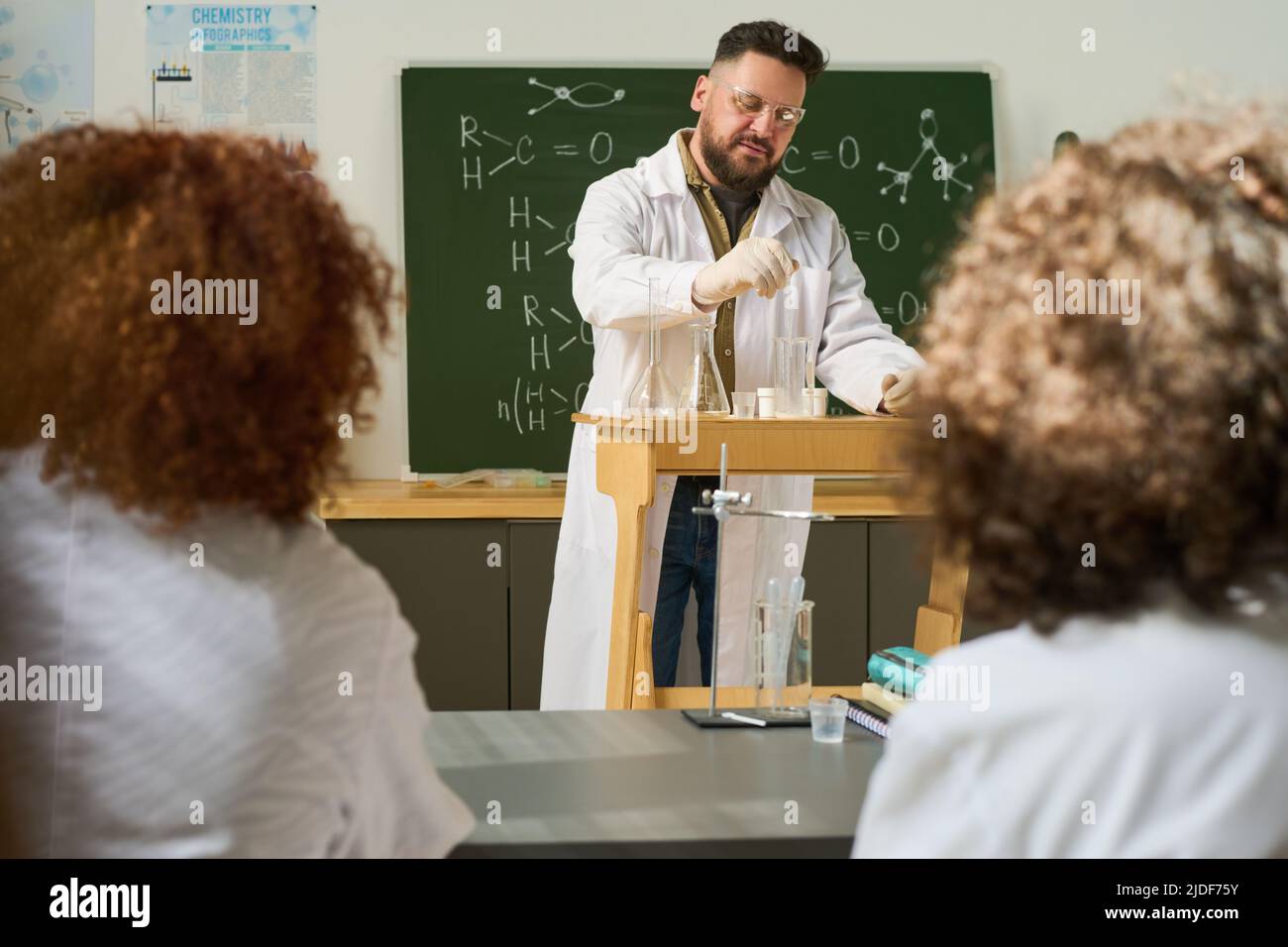 Chemistry class student doing experiment hi-res stock photography and ...