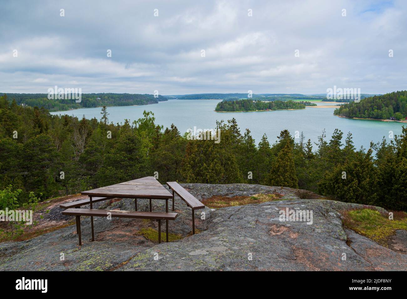 Scenic view of sea and lush shoreline from above in Åland Islands, Finland, on a cloudy day in the summer. Stock Photo
