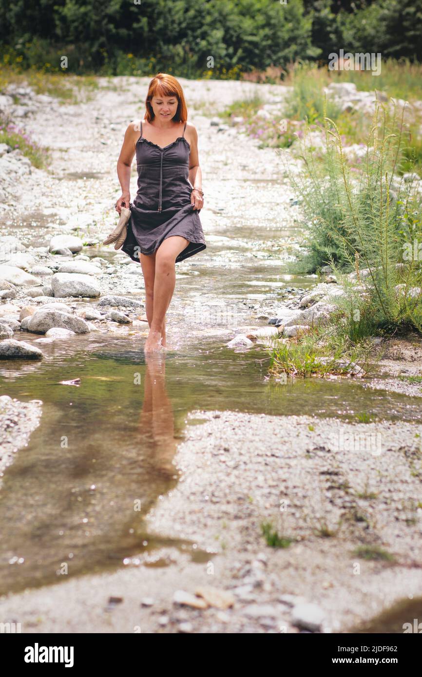 Barefoot woman walking in forest hi-res stock photography and images ...