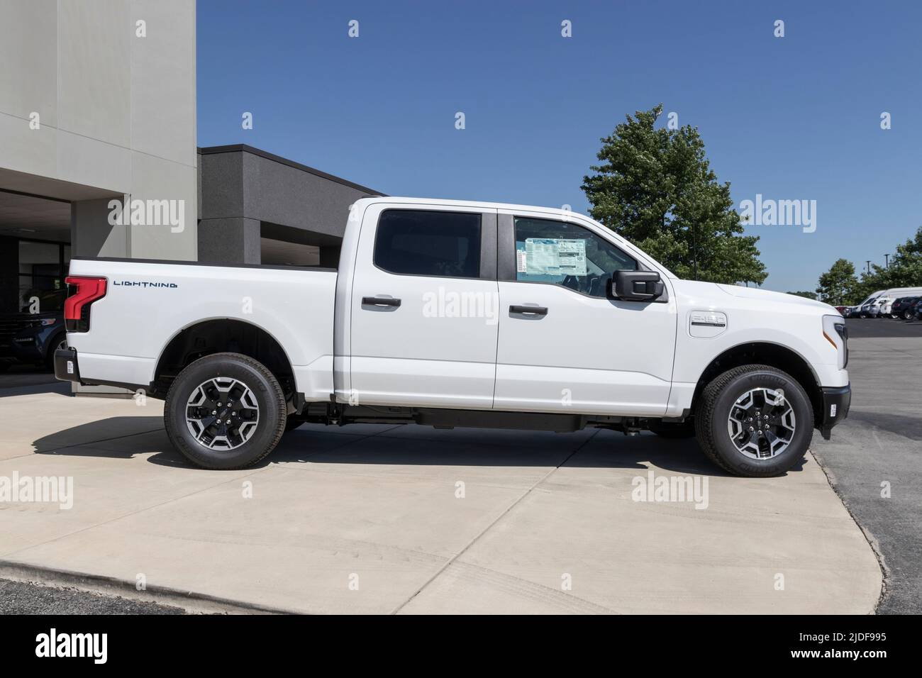 Zionsville - Circa June 2022: Ford F-150 Lightning display. Ford offers the F150 Lightning all-electric truck in Pro, XLT, Lariat, and Platinum models Stock Photo