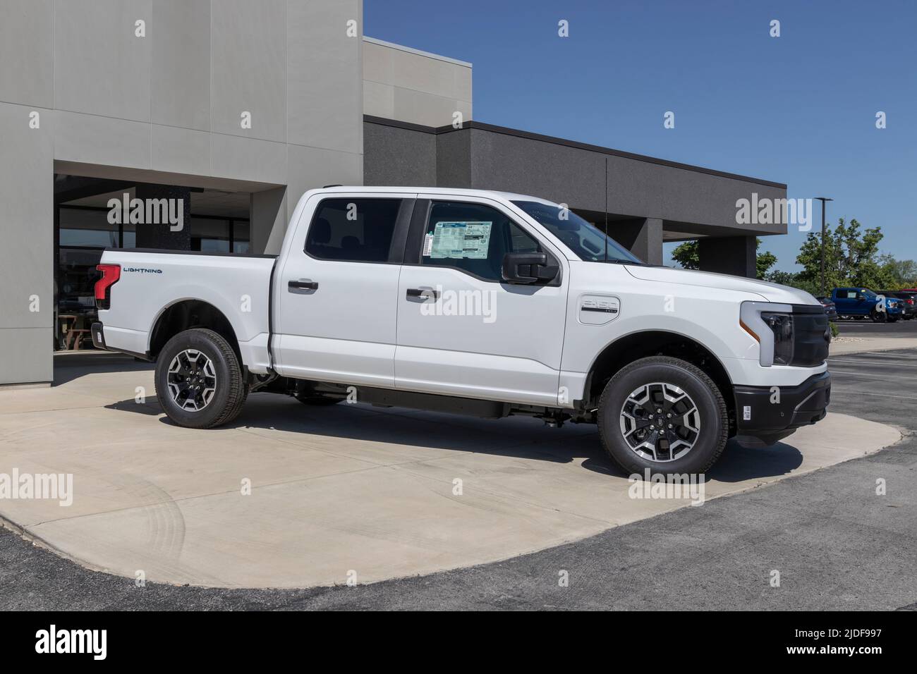 Zionsville - Circa June 2022: Ford F-150 Lightning display. Ford offers the F150 Lightning all-electric truck in Pro, XLT, Lariat, and Platinum models Stock Photo