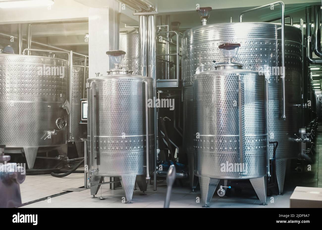 Typical steel barrels for wine fermentation in winery factory Stock Photo Alamy