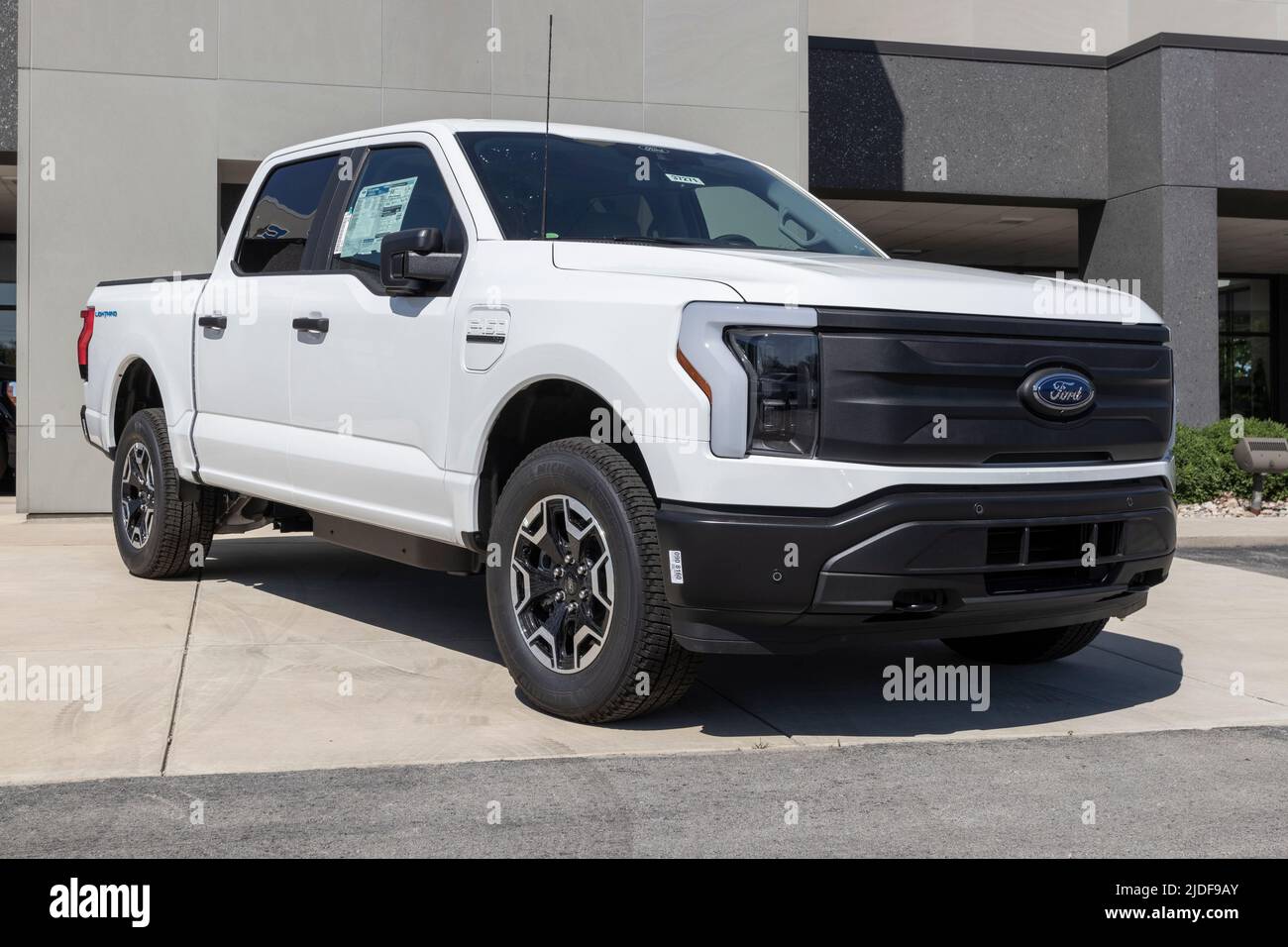 Zionsville - Circa June 2022: Ford F-150 Lightning display. Ford offers the F150 Lightning all-electric truck in Pro, XLT, Lariat, and Platinum models Stock Photo