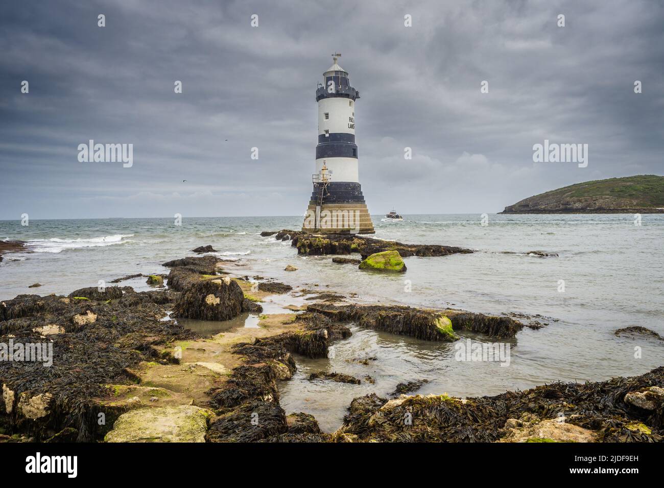 Black Point, Penmon, Ynys Seiriol, Anglesey, North Wales, UK. Trwyn Du Lighthouse at Penmon point was built by Trinity House in 1838 to mark the north Stock Photo