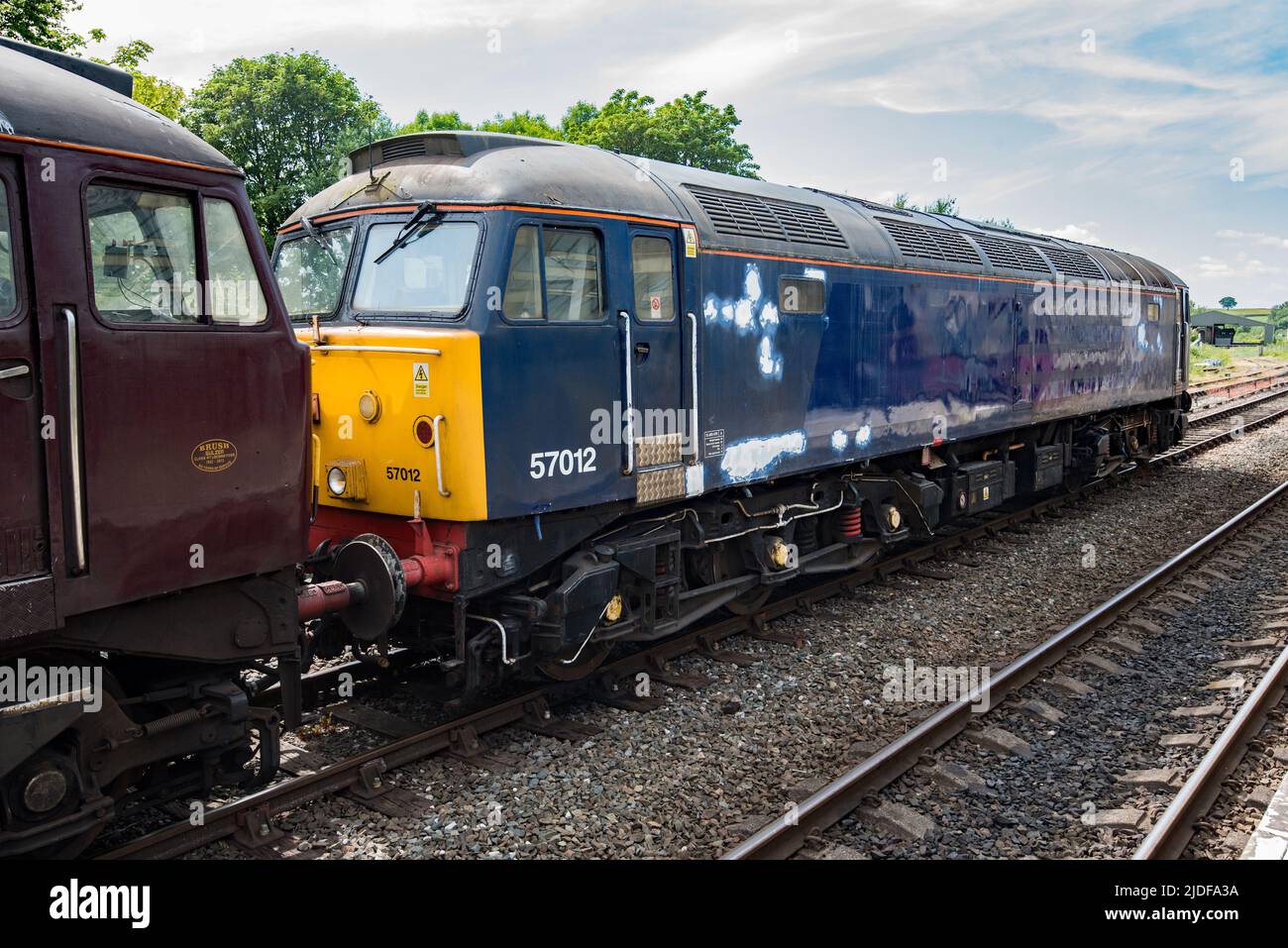 British Rail class 57 diesel locomotive passing through Hellifield, in North Yorkshire, on 20th June 2022 Stock Photo