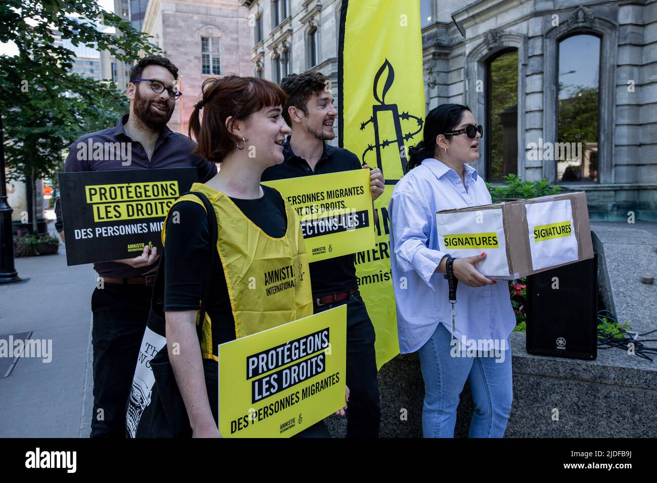 Amnesty International's staff hold placards supporting human rights during the protest. Stock Photo