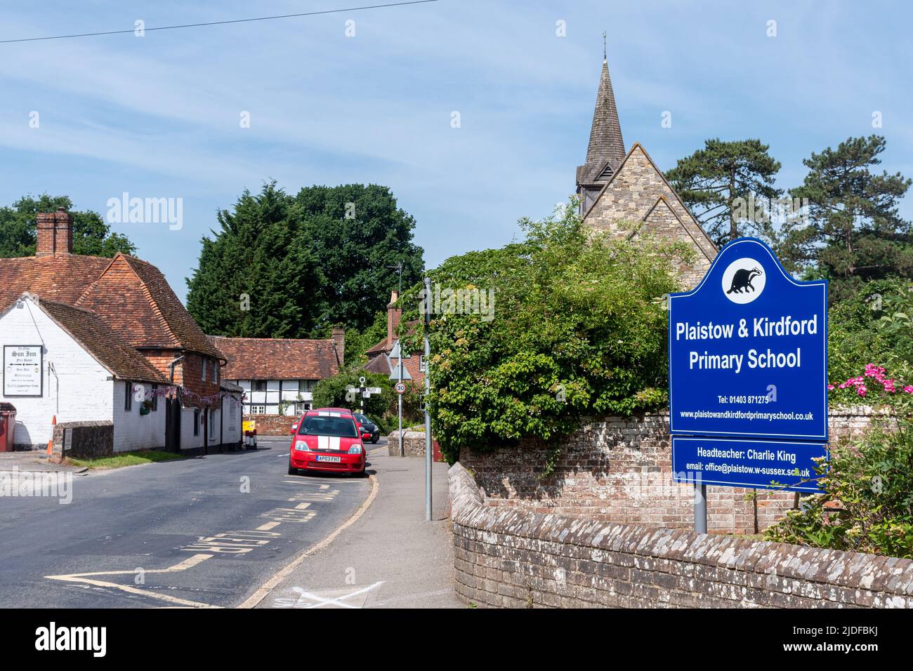 Plaistow village in West Sussex, England, UK, with the primary school, church and village pub Stock Photo