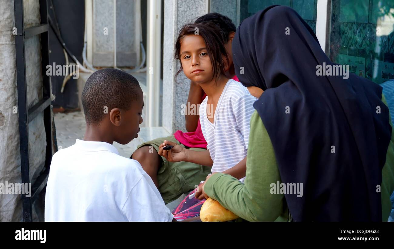 Turkey. 20/06/2022, Syrian and African child refugees struggle to make a living by collecting and selling paper and cardboard for recycling, and sometimes selling handkerchiefs for asking alms. They are the children of families who migrated to Turkey as refugees due to war, economical and political reasons. Child refugees who go to Turkish schools and speak Turkish language well, work out of school days at their early age. They earn between 25 TL and 100 TL per day. The eldest of the group, the teenager Syrian girl, says that they fled the war 8 years ago and took refuge in Turkey. Child refug Stock Photo