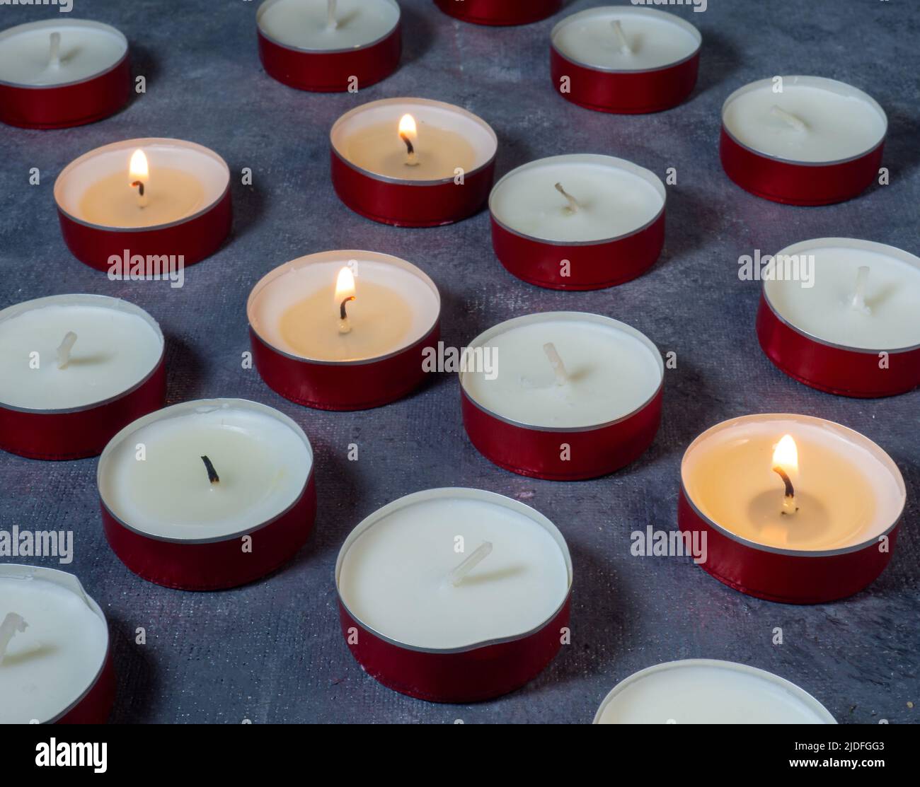 Pillar wax candle burning on white background Stock Photo - Alamy