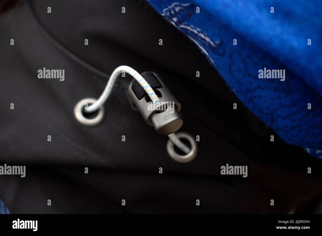 Close up of a waterproof jacket , band to tighten the hood Stock Photo