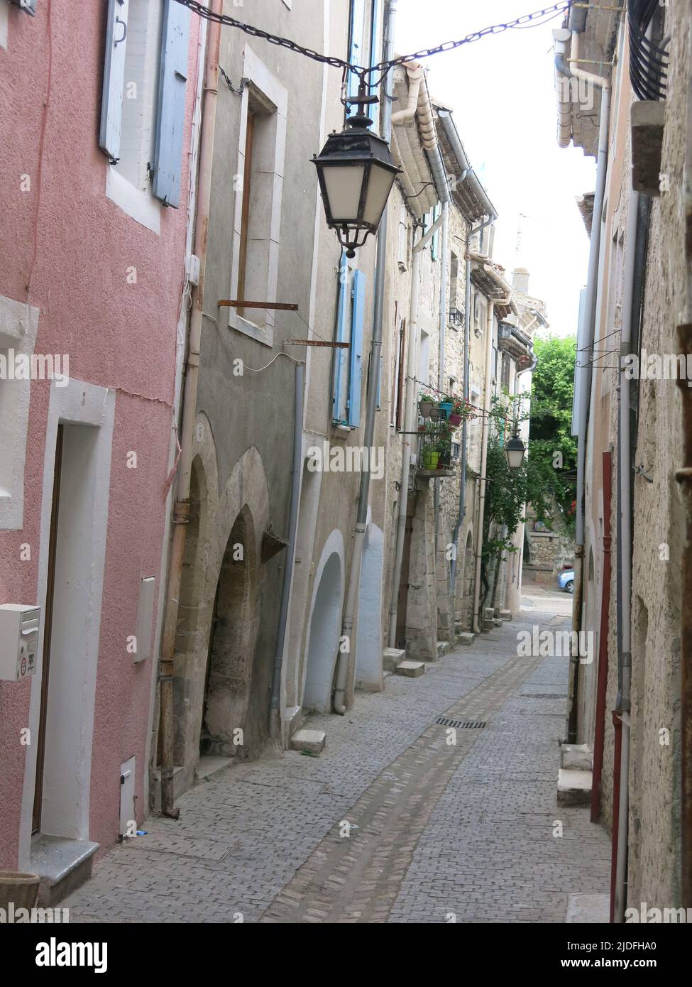 Follow a heritage trail through the narrow, winding streets of tall buildings in the quaint old town of Viviers, France's smallest city. Stock Photo