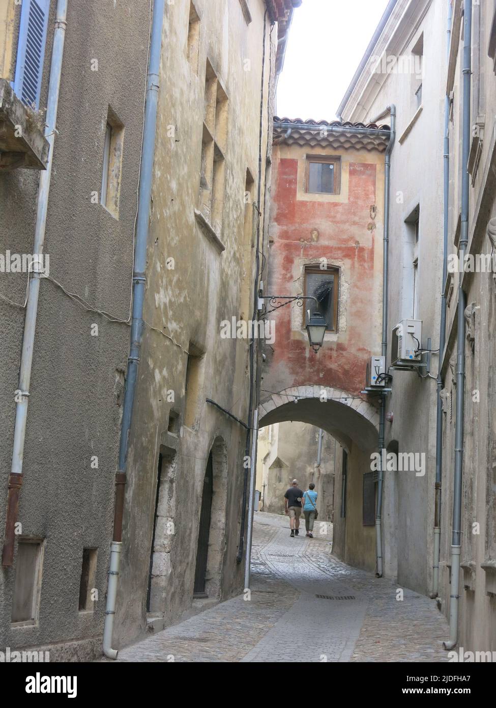 Follow a heritage trail through the narrow, winding streets of tall buildings in the quaint old town of Viviers, France's smallest city. Stock Photo