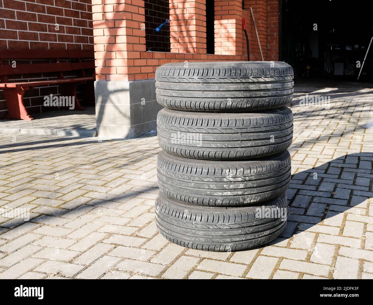 Stacked summer car tires are prepared for seasonal replacement Stock