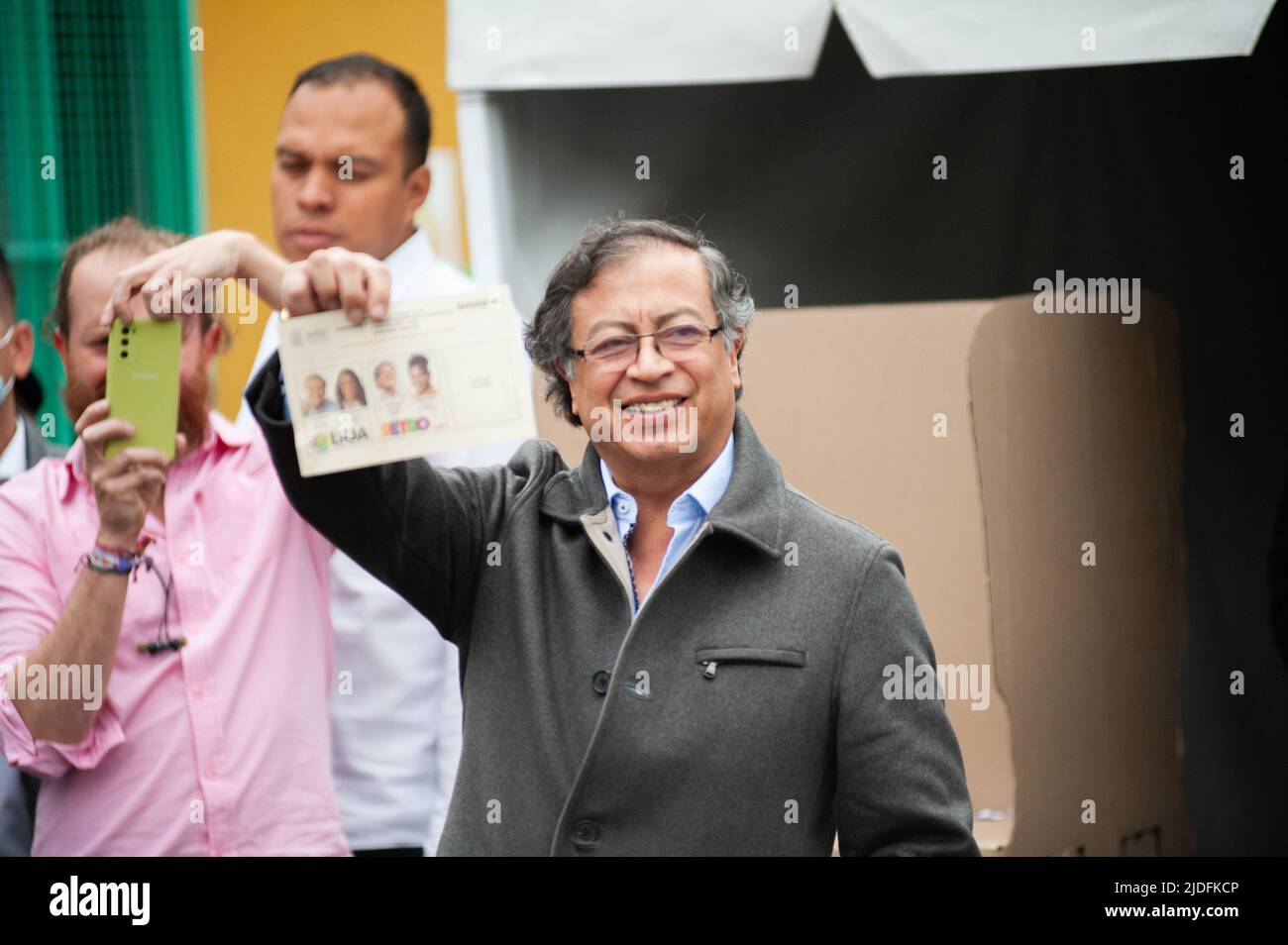 Left-wing presidential Candidate Gustavo Petro shows his vote to the media during the voting rally for the presidential runoffs between left-wing Gust Stock Photo