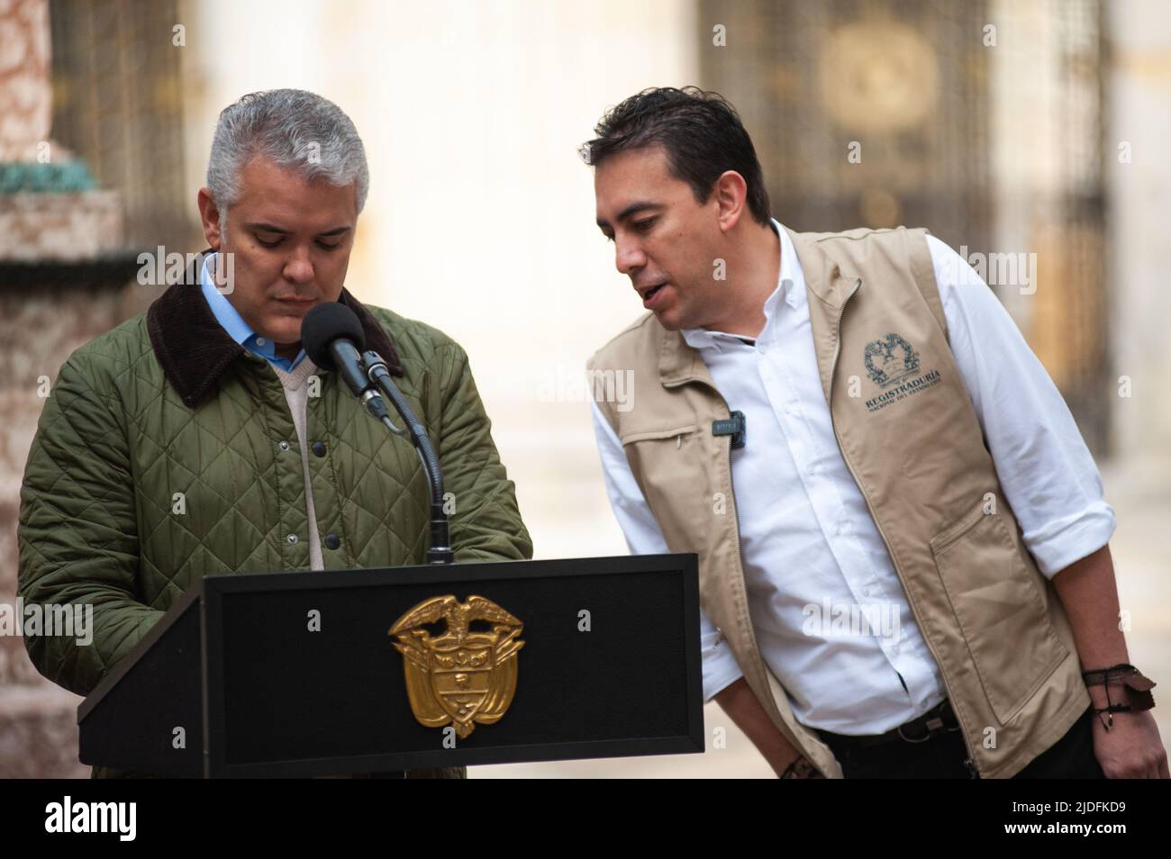 National registrar of Colombia Alexander Vega speaks with Colombian President Ivan Duque Marquez during the voting rally for the presidential runoffs Stock Photo