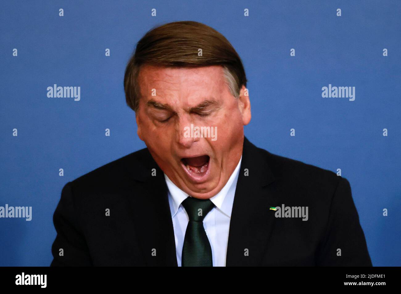 Brazil's President Jair Bolsonaro yawns during a ceremony about the National Policy for Education at the Planalto Palace in Brasilia, Brazil June 20, 2022. REUTERS/Ueslei Marcelino Stock Photo