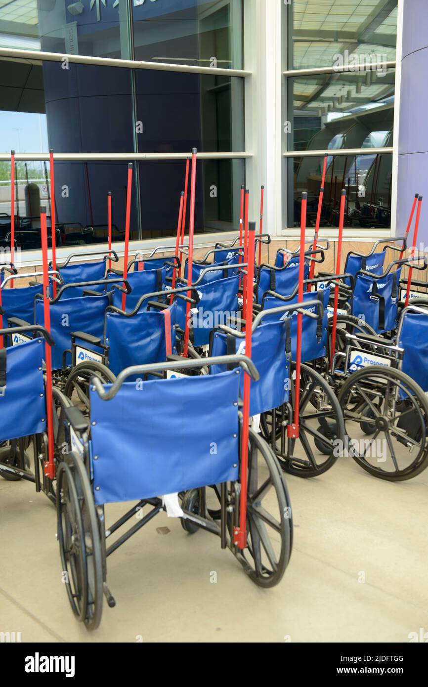 Wheelchairs outside Tucson International Airport for handicapped passengers. Stock Photo