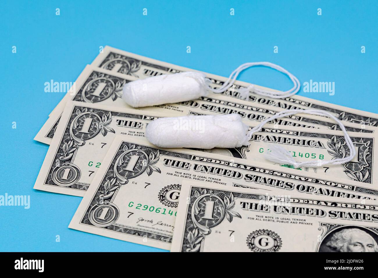 Tampons and cash money. Tampon shortage, tax, pink tax and feminine hygiene products price increase concept Stock Photo