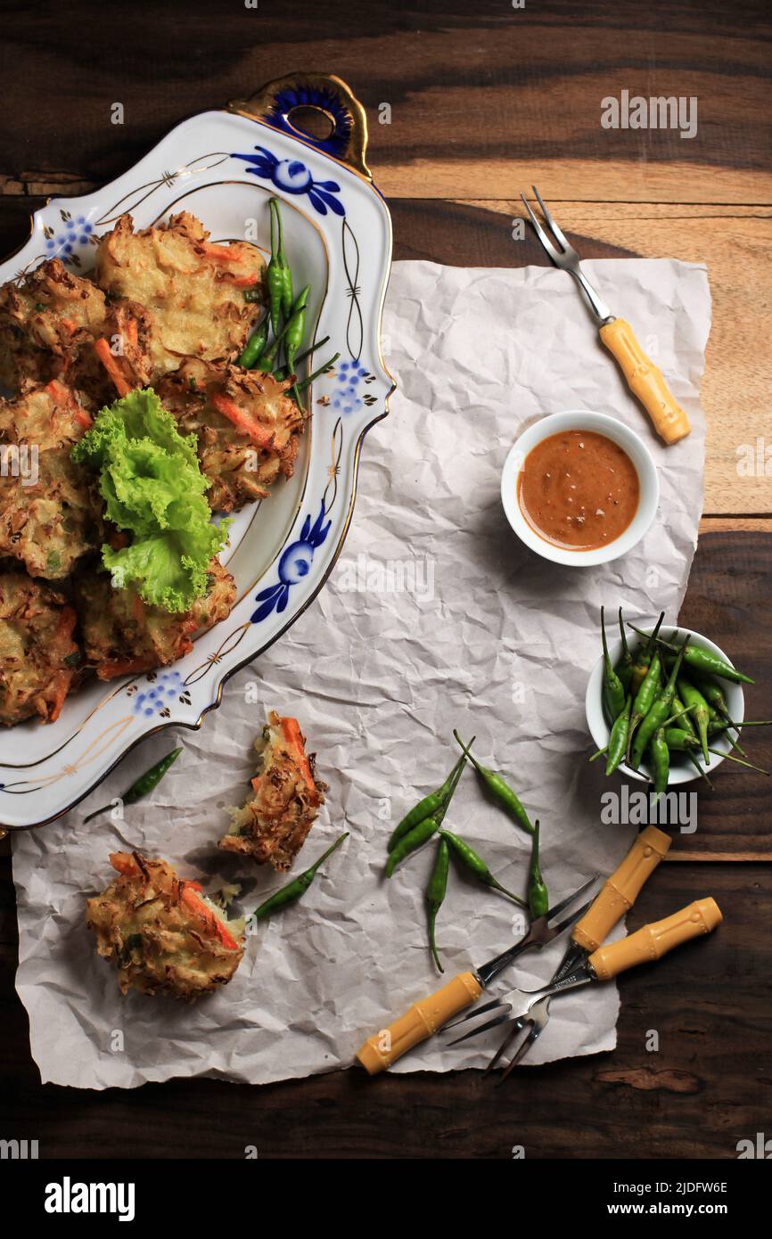 Bakwan or Bala Bala is a Fried Food Made from Vegetables and Flour. Bakwan is Indonesian Street Food Snack. Stock Photo