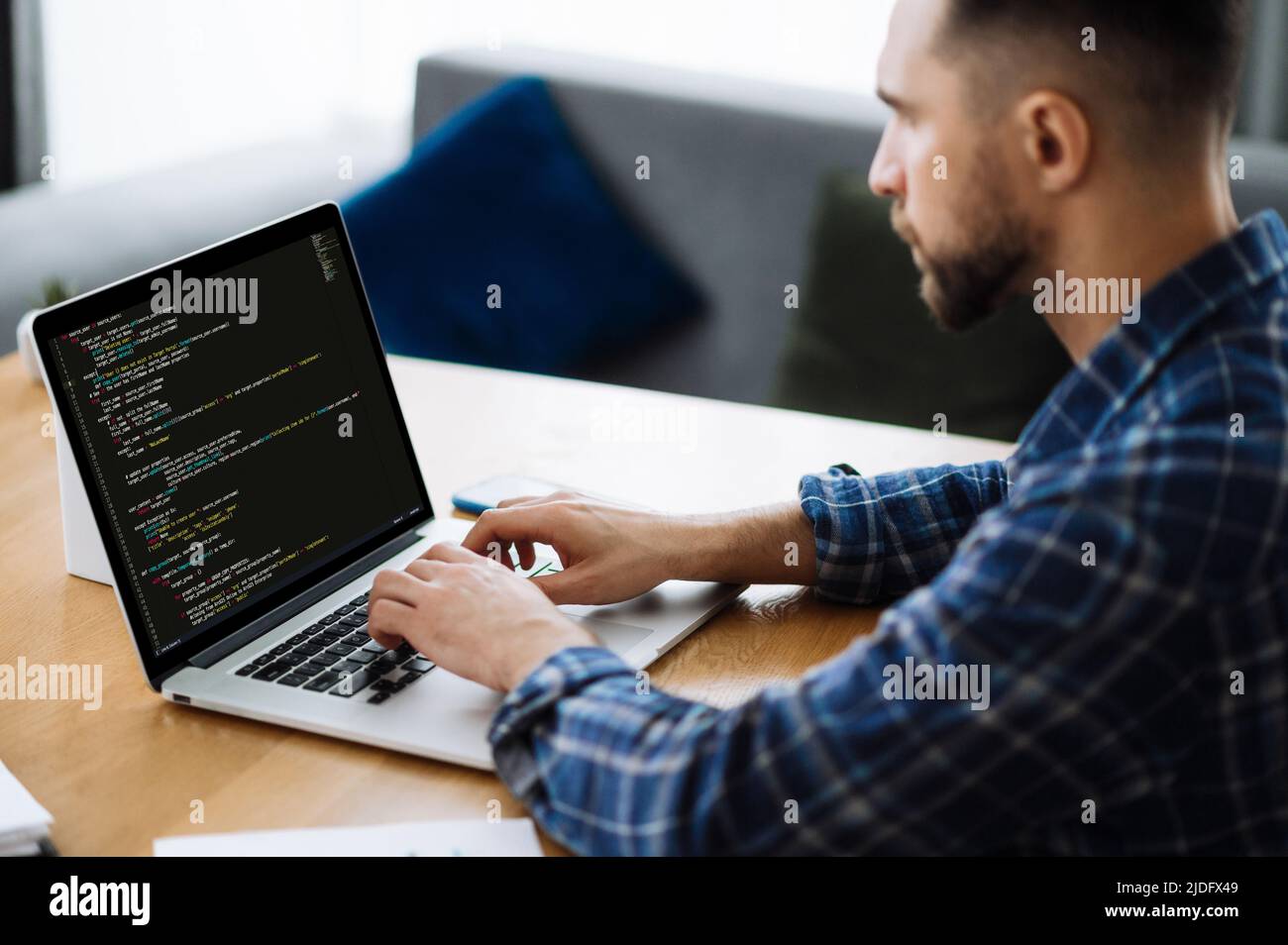 Software concept. Side view of smart caucasian IT specialist ...