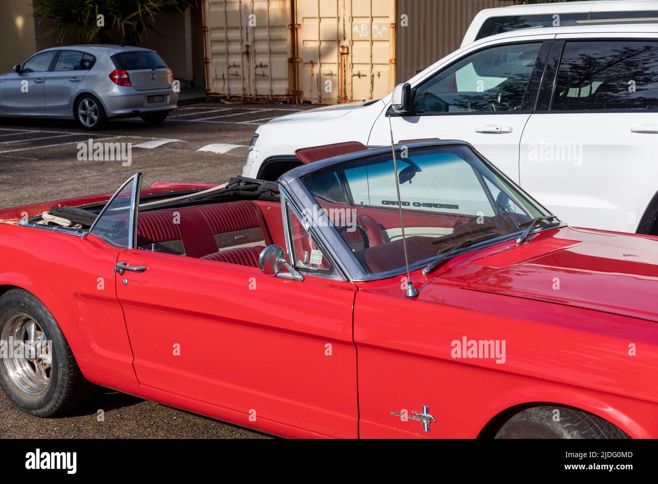 Classic car, 1966 red Ford Mustang convertible vehicle parked at Newport Beach in Sydney with the roof down,NSW,Australia Stock Photo
