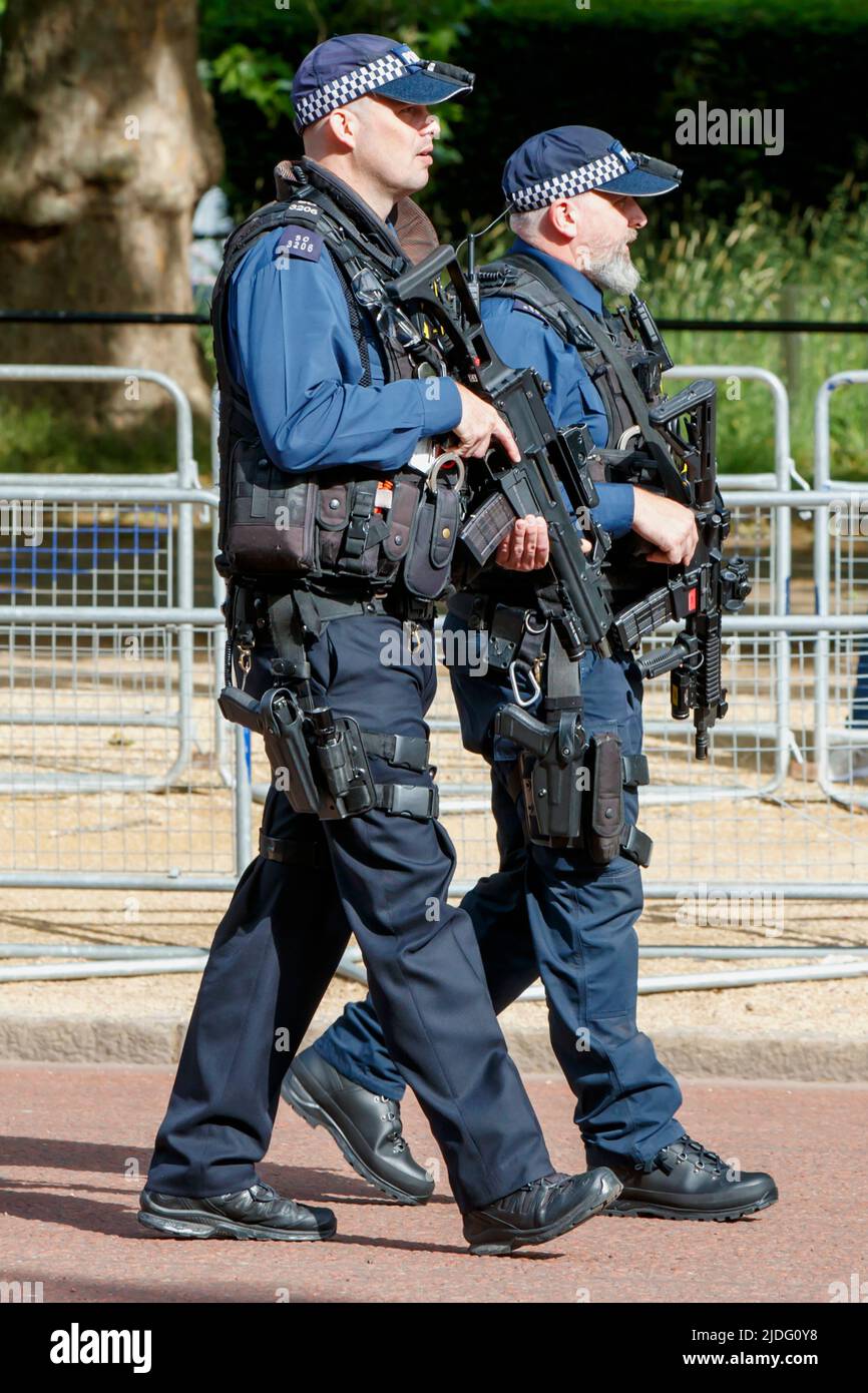 Armed Police officers on patrol at the Trooping the Colour Rehearsals, The Mall, London England, United Kingdom, Saturday, May 21, 2022. Stock Photo