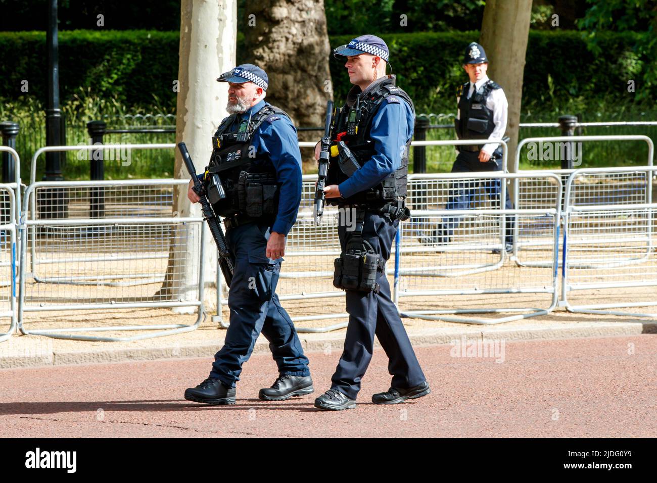 Armed Police officers on patrol at the Trooping the Colour Rehearsals, The Mall, London England, United Kingdom, Saturday, May 21, 2022. Stock Photo