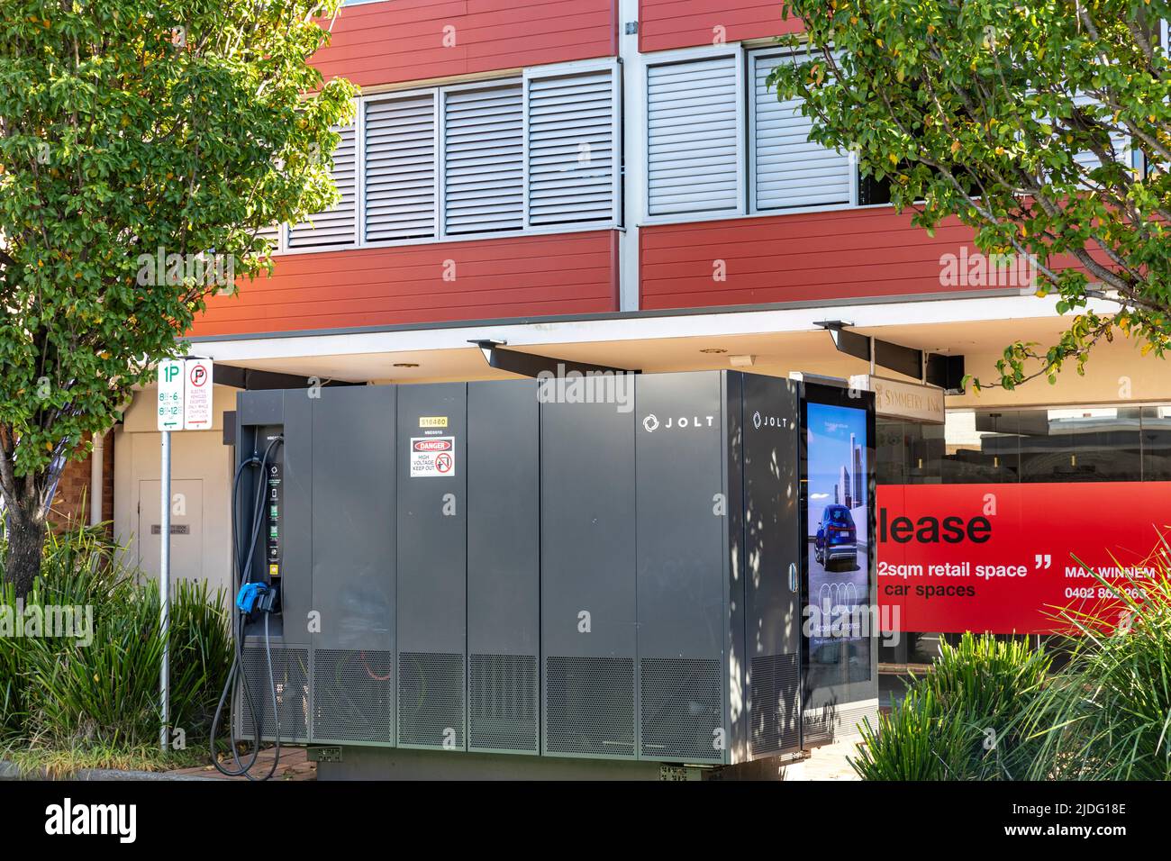 Jolt public EV charging station on Mona Vale high street in Sydney,NSW,Australia, EV owners receive 7kwh charge for free Stock Photo
