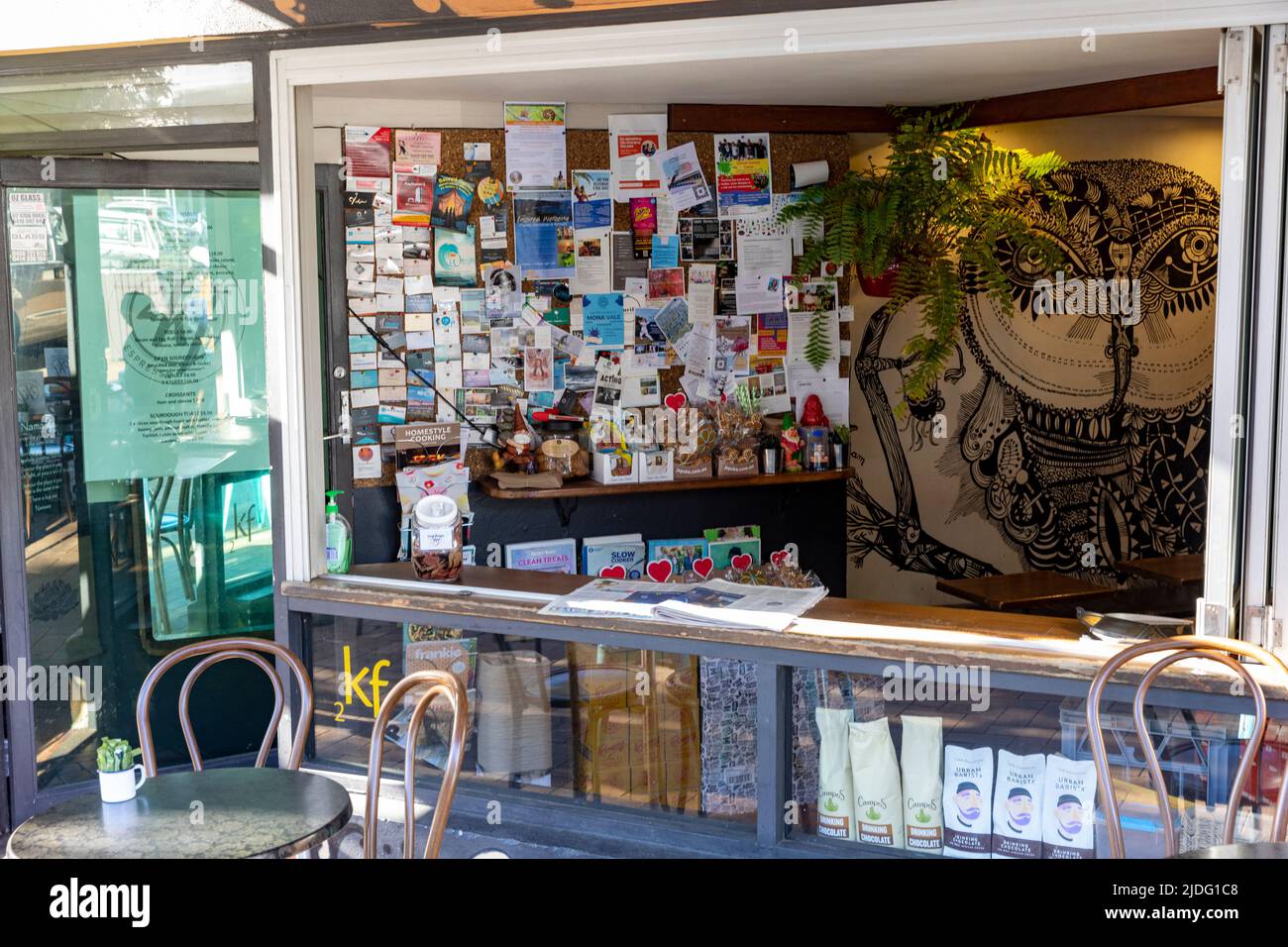 Australian cafe and coffee shop with a pin noticeboard inside for flyers, business cards and public notices,Sydney,NSW,Australia Stock Photo