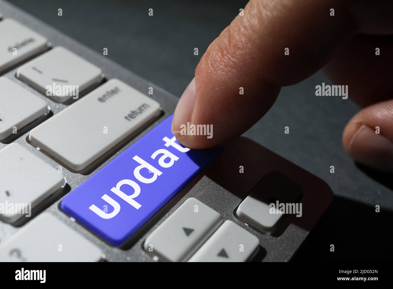 Man pressing button with word UPDATE on modern computer keyboard, closeup  Stock Photo - Alamy