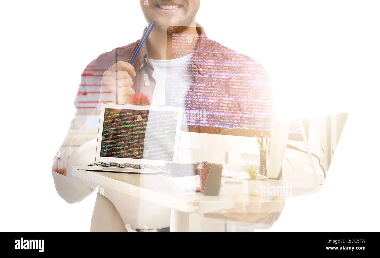 Double exposure of young male programmer and modern computers in office ...